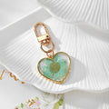 Gold Tone Pressed Flower Daisy Heart Snap-Hook Keychains in Ten Options view 10