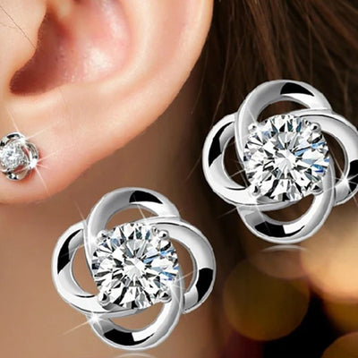 Silver Tone open flower center studs shown in measurement view with printed dimensions or weight