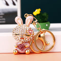 Jeweled Strawberry Holding Rabbit Keychains in Four Pictured Colors view 4
