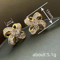 Clear Crystal Five Petal Flower Stud Earrings in Gold Tone view 4