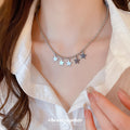 Silver Star Moon and Cloud Charm Necklace with Polished Metal Details view 1