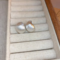 Brushed Curved Stud Earrings in Three Metallic Finishes view 8