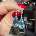Sea Blue Pear Drop Earrings White Metal Clear Bezel Posts view 4