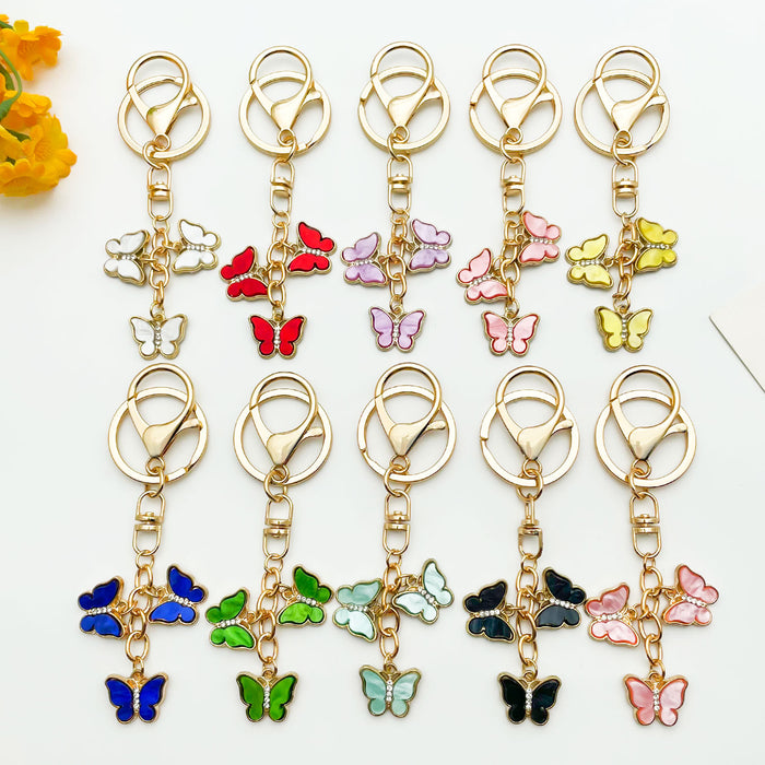 Butterfly Charm Keychains Featuring Blue Butterfly Across 35 Pictured Variations