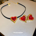 Red Heart Stud Earrings And Cord Pendant Necklace With Polished Metal Tone Details view 1