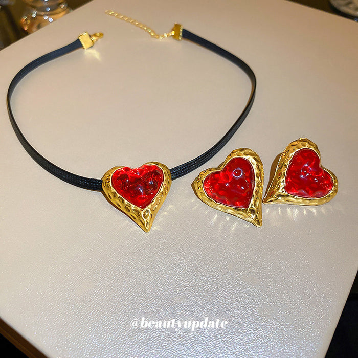 Red Heart Stud Earrings And Cord Pendant Necklace With Polished Metal Tone Details