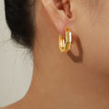 Gold Hexagon Huggie Hoop Earrings Faceted Geometric Frame view 1