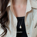Silver Tone Necklace With Large Teardrop Pearl Like Pendant view 1