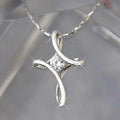 Silver-Tone Twisted Cross Necklace with a Cubic Zirconia Center view 1