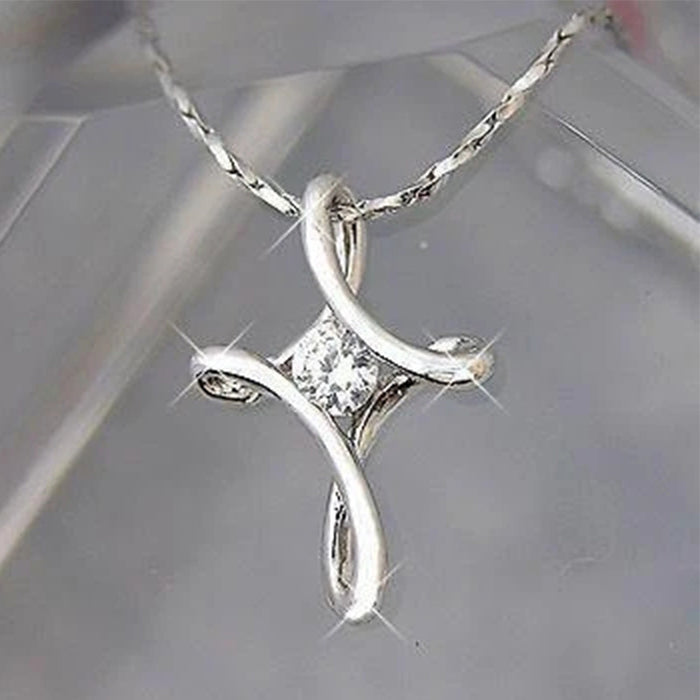 Silver-Tone Twisted Cross Necklace with a Cubic Zirconia Center