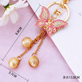Pink Crystal Butterfly Tassel Keychain with Three Gold Tone Bead Drops view 6