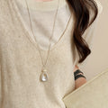Silver Tone Abstract Pendant Necklace with White Center view 4