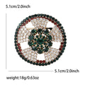 Round Crystal Wreath Brooch Emerald Center Red Green Rim view 6