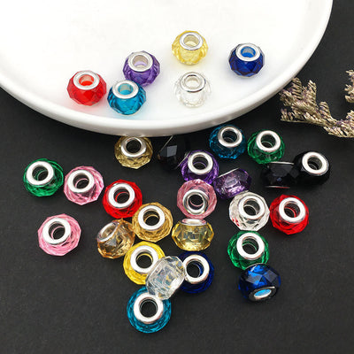 Colorful bead beads arranged on a light background