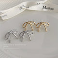 Minimal Wire Bow Stud Earrings Gold and Silver Tones view 1