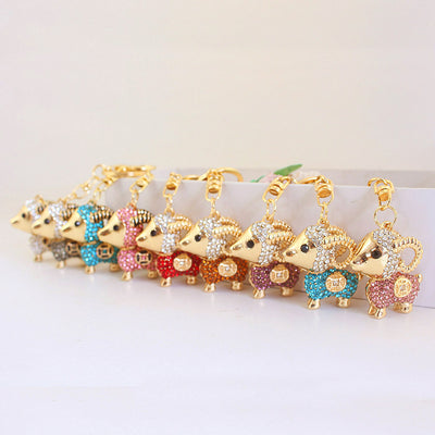Multiple rhinestone ram charms in assorted colors arranged in a row.