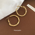 Gold Tone Twisted Medium Hoop Earrings with Detailed Finish view 2