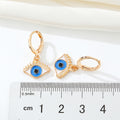 Gold Tone Enamel Evil Eye Huggie Drop Earrings in Two Colors view 4