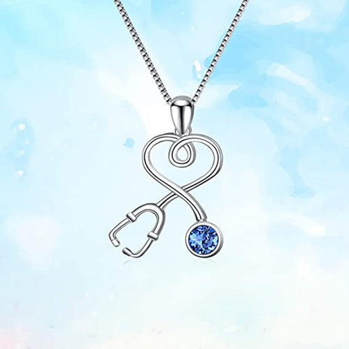 Front view of white metal stethoscope heart pendant with blue stone