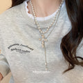 Layered White Pearl Look Cross Pendant Necklace with Metal Tone Details view 3