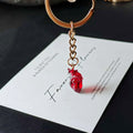 Transparent Red Anatomical Heart Keychain with Silver Tone Split Ring view 1