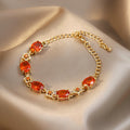 Gold Tone Bracelet With Green Oval Stones And Crystal Flowers view 3