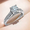 Four-Prong Round Cubic Zirconia Ring with Pave Shank in Silver-Tone view 1
