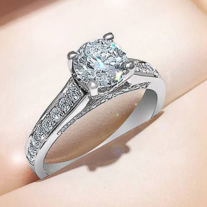 Four-Prong Round Cubic Zirconia Ring with Pave Shank in Silver-Tone