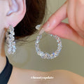 Silver Tone Crystal Hoop Earrings With Polished Metal Details view 1