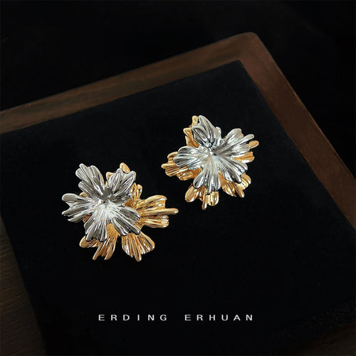 Two-tone gold and silver leaf studs on black tray