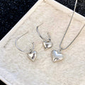 Silver Puffed Heart Pendant Necklace and Hoop Earrings view 2