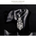 Silver Tone Crystal Scroll Teardrop Openwork Crystal Metal Dangle Earrings view 3