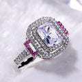Square White Stone Ring with Pink Side Stones and Pavé Halo view 2