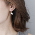 Simple Five Point Star Hook Drop Earrings in Two Finishes view 7