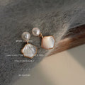 White Pearl Top And Gold Edged Shell Shape Drop Stud Earrings view 1