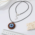 Wood Scalloped Round Blue Evil Eye Pendant Necklace on Black Cord view 4
