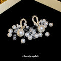 Gold Tone Bow Earrings With White Pearl And Crystal Clusters view 2