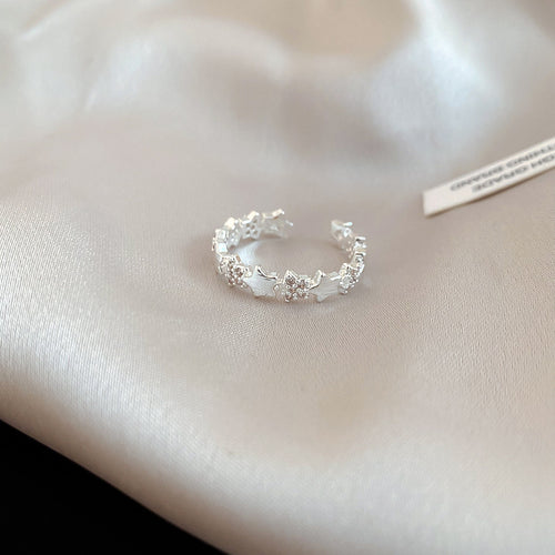 Silver floral leaf open ring with clear stones on satin