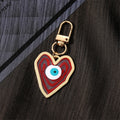 Gold Tone Swirled Heart Evil Eye Clip Keychains in Five Colors view 2