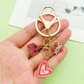 Heart Charm Keychains Featuring Pink Heart Across 35 Pictured Variations view 1