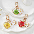 Gold Tone Daisy and Pressed Flower Heart Snap-Hook Keychains in Ten Options view 2