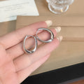 Gold and Silver Irregular Oval Medium Huggie Hoop Earrings view 7