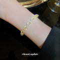 Gold Tone Open Cuff Bracelet With Crystal Buckle Link Pattern view 2
