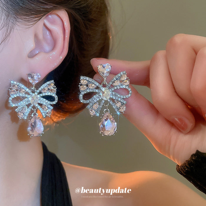 Silver Tone Crystal Bow Stud Earrings With Pink Teardrop Accents