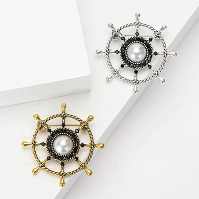 Front view of nautical ship wheel with pearl spokes and rope textured metal rim