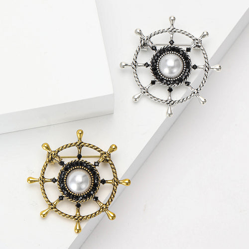 Front view of nautical ship wheel with pearl spokes and rope textured metal rim