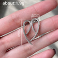 Twisted Open Loop Crystal Drop Earrings in Polished Metal view 5