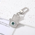 Gold and Silver Tone Geometric Hamsa and Eye Clip Keychains view 8