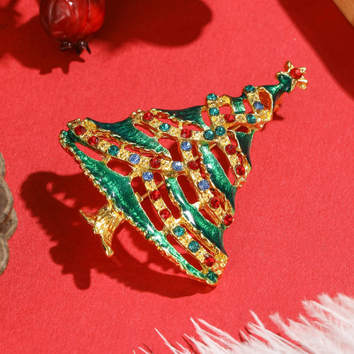 Angled green enamel tree pin gold openwork branches rhinestone garland on red