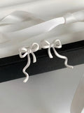 Wavy Bow Clip On Earrings in Silver and Gold Tone With Decorative Details view 6